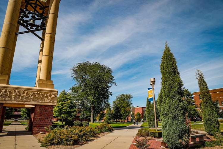 体育菠菜大平台 bell tower and campus greens on a sunny day